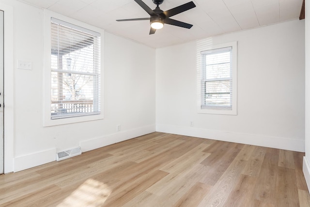 spare room featuring ceiling fan and light wood-type flooring