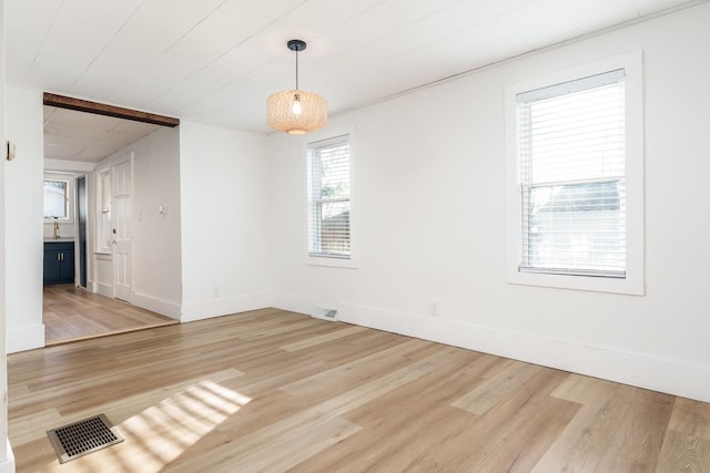 unfurnished room with light hardwood / wood-style flooring