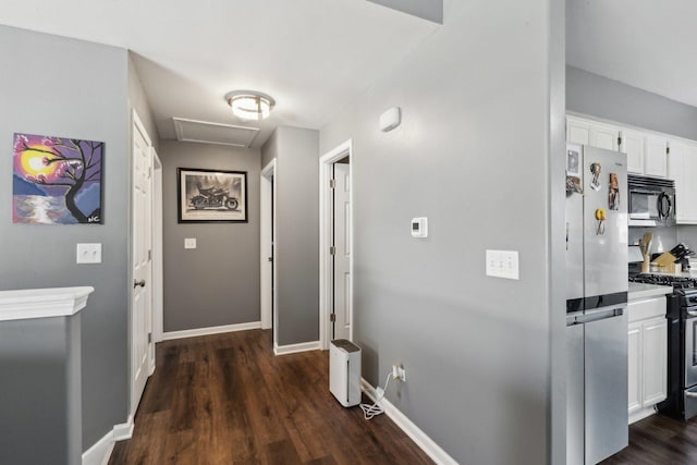 corridor featuring dark hardwood / wood-style floors