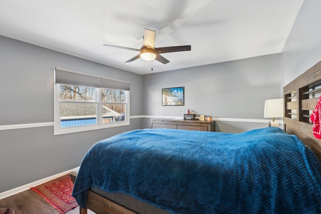 bedroom featuring ceiling fan and wood-type flooring