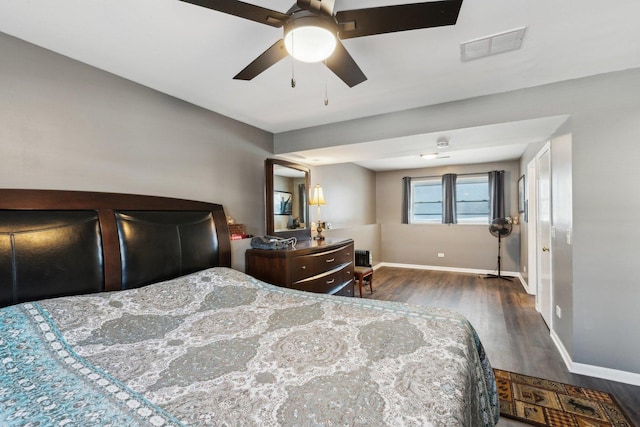 bedroom featuring ceiling fan and dark wood-type flooring