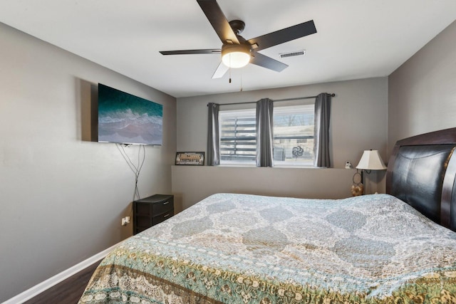 bedroom with hardwood / wood-style floors and ceiling fan