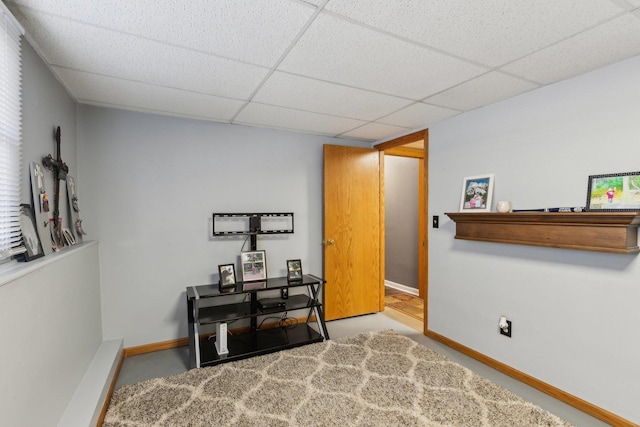 interior space featuring a paneled ceiling