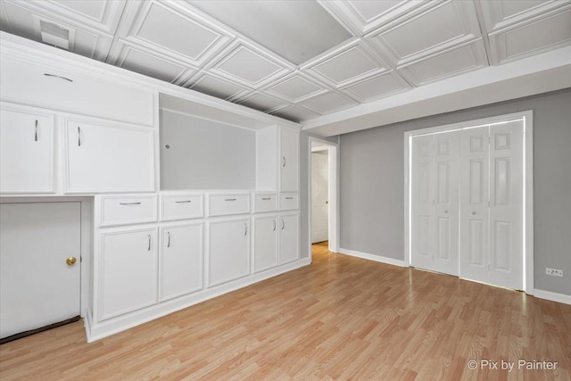 unfurnished bedroom featuring light hardwood / wood-style floors and a closet