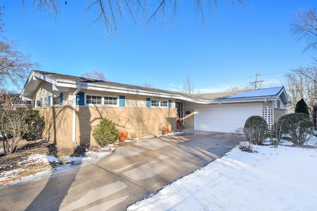 single story home featuring a garage