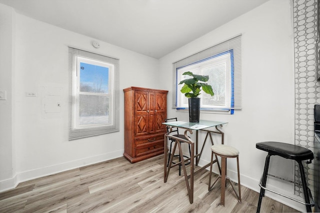 dining space with light wood-type flooring