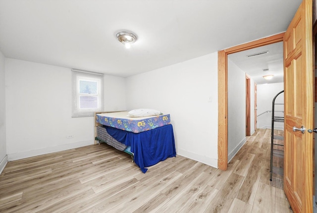 bedroom featuring light wood-type flooring