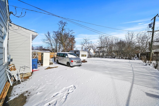 view of yard layered in snow