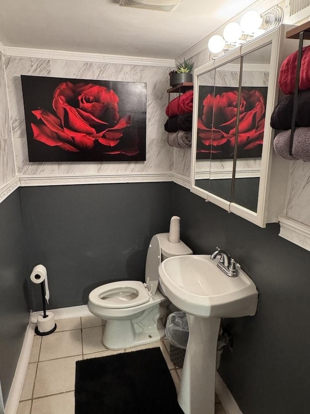 bathroom with tile patterned floors and toilet