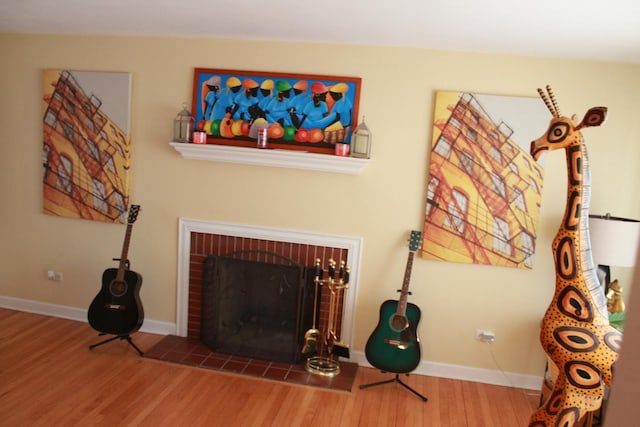 living room featuring hardwood / wood-style flooring and a fireplace