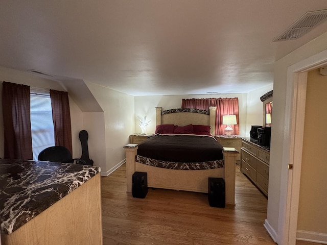 bedroom featuring hardwood / wood-style floors