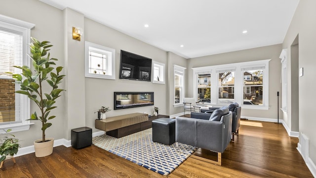 living room with dark hardwood / wood-style floors