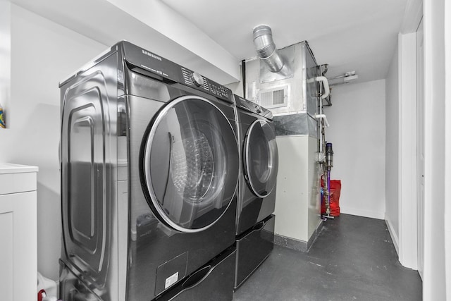 clothes washing area with washer and dryer