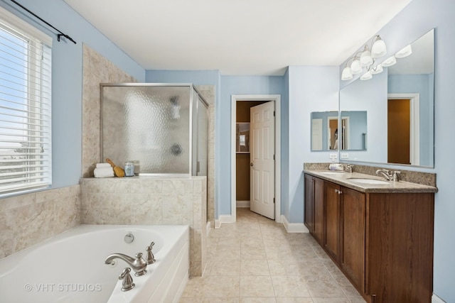 bathroom featuring tile patterned floors, plus walk in shower, and vanity