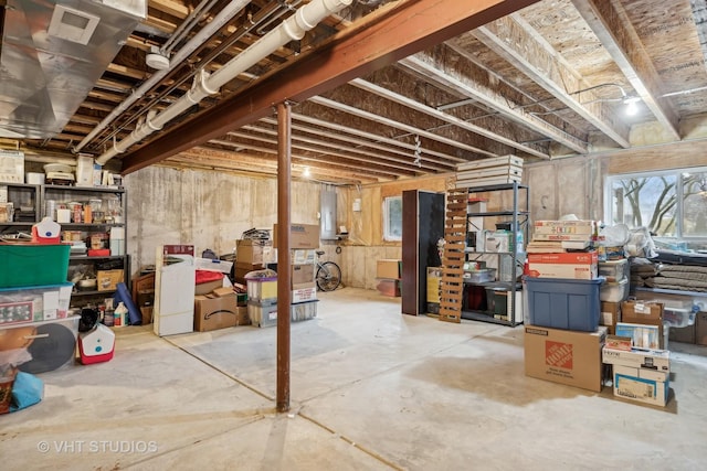 basement featuring electric panel