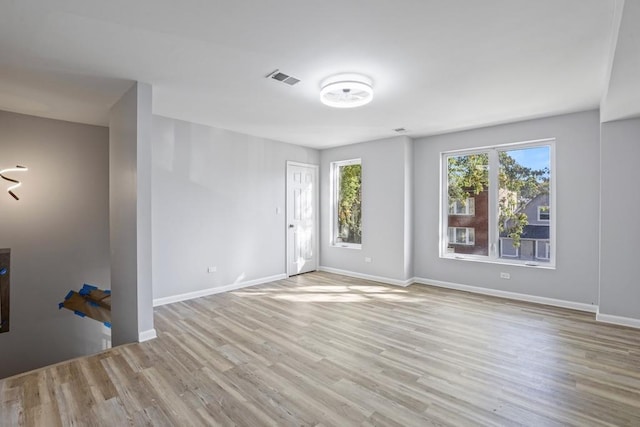 unfurnished room featuring light hardwood / wood-style flooring