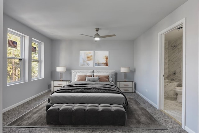 bedroom with connected bathroom, ceiling fan, and carpet floors