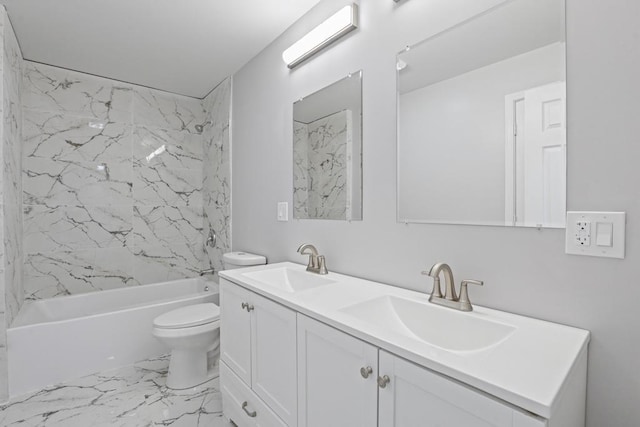 full bathroom featuring vanity, tiled shower / bath combo, and toilet