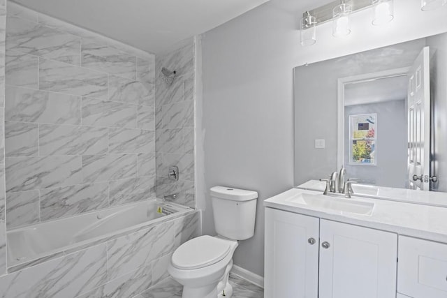 full bathroom featuring vanity, toilet, and tiled shower / bath