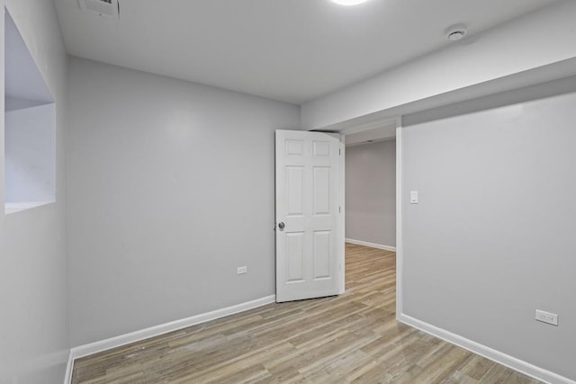 unfurnished room with light hardwood / wood-style flooring