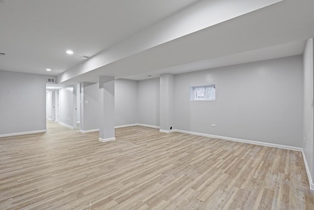 basement featuring light hardwood / wood-style floors