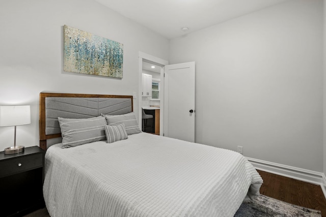 bedroom with wood-type flooring