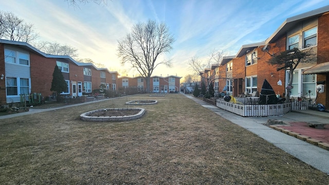 view of home's community with a lawn