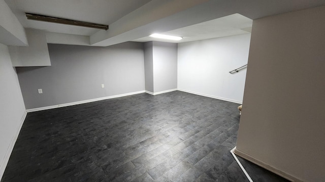 basement featuring dark hardwood / wood-style floors