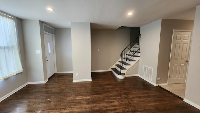 entrance foyer featuring dark wood-type flooring