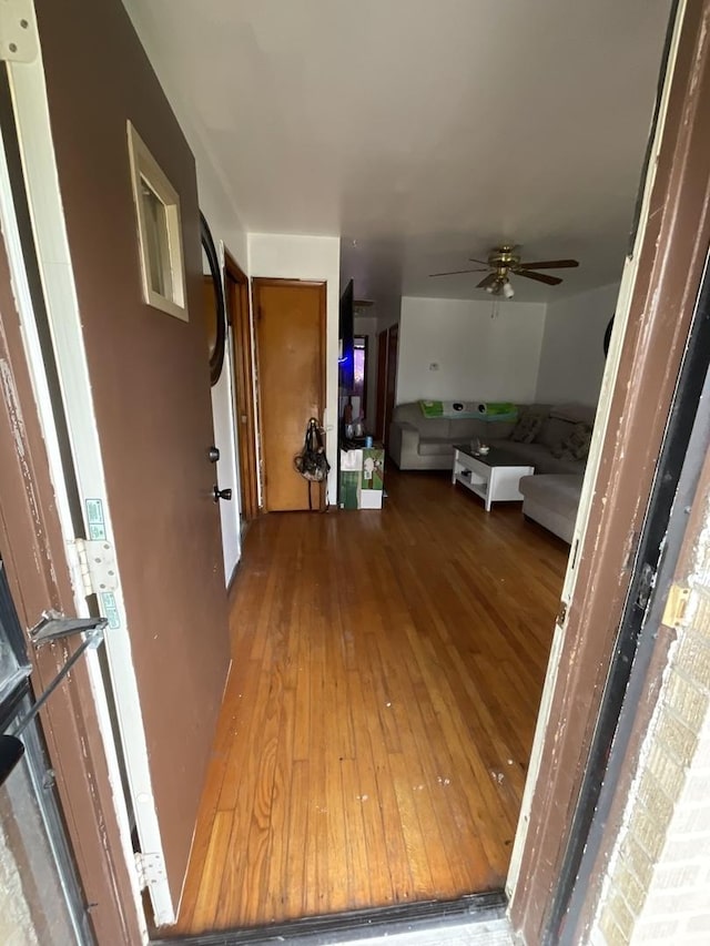 corridor featuring hardwood / wood-style floors