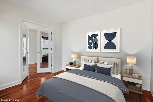 bedroom with dark hardwood / wood-style flooring and french doors