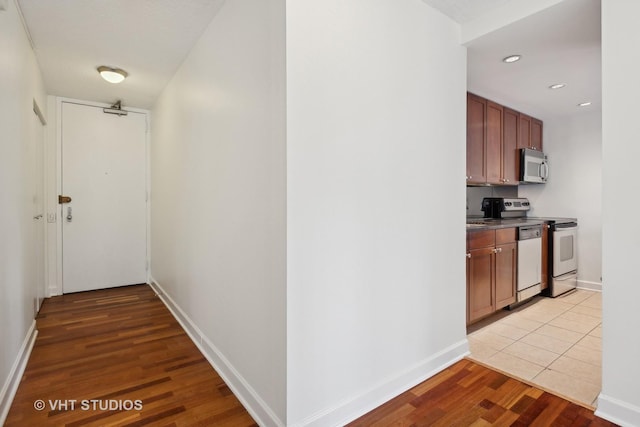 hallway with light tile patterned flooring