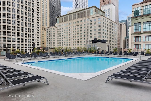 view of swimming pool featuring a patio area