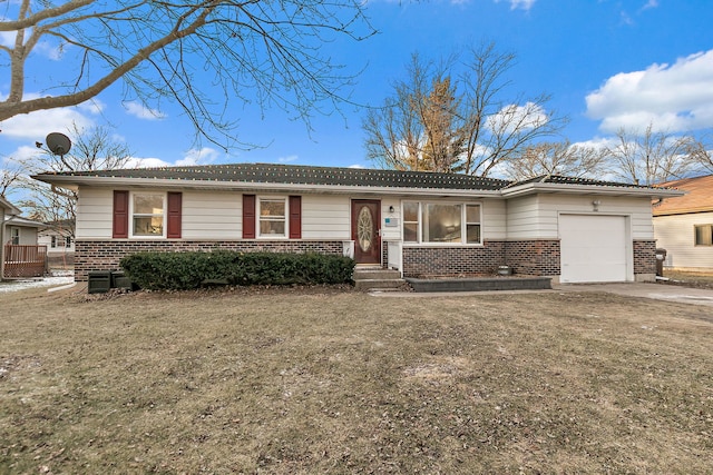 single story home featuring a front lawn and a garage