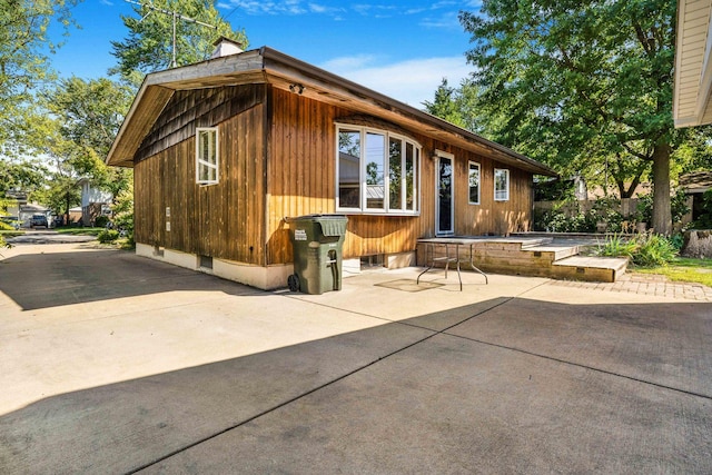 view of property exterior featuring a patio