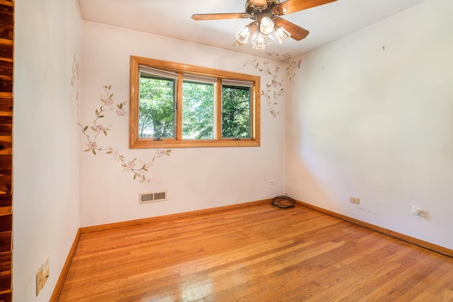 unfurnished room with ceiling fan and light wood-type flooring