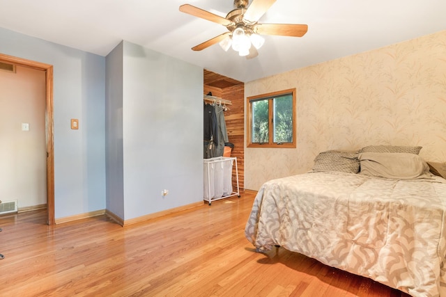 bedroom featuring ceiling fan and light hardwood / wood-style flooring