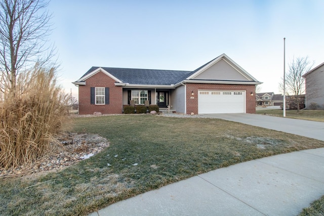 ranch-style house featuring a garage and a lawn