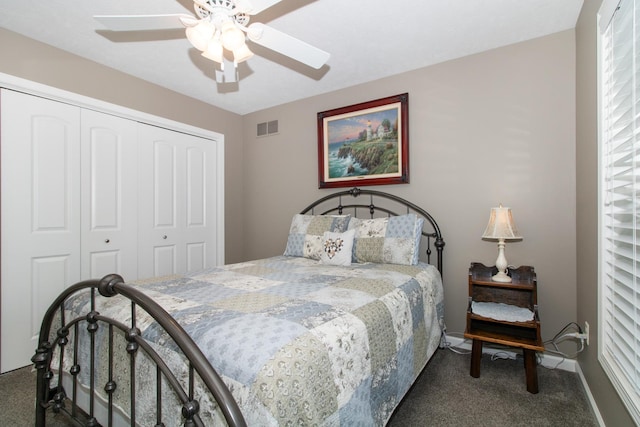 carpeted bedroom featuring ceiling fan and a closet