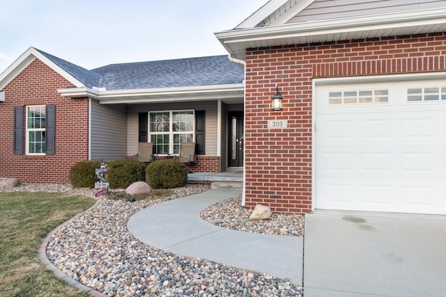 entrance to property with a porch and a garage