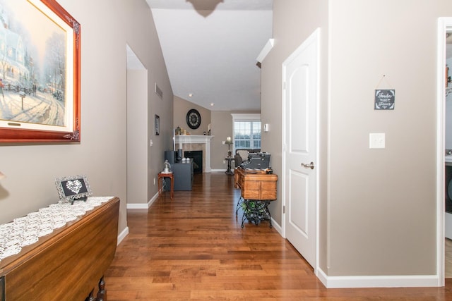 corridor with hardwood / wood-style flooring