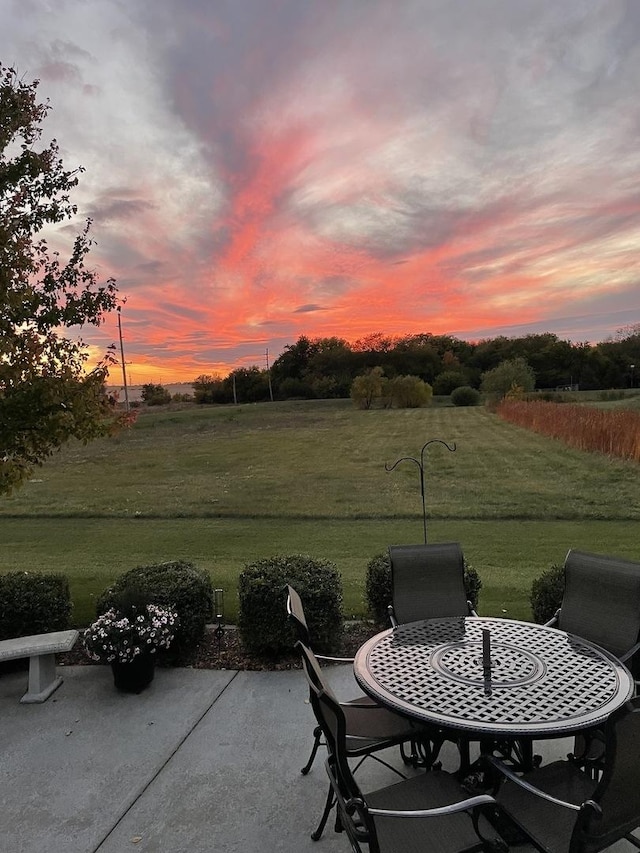 patio terrace at dusk with a yard