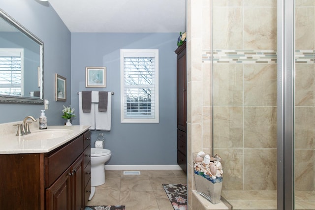 bathroom with vanity, a wealth of natural light, and a tile shower