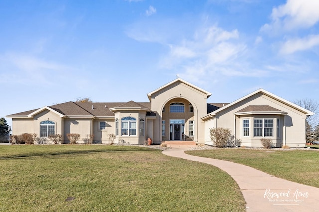 view of front of house with a front lawn and stucco siding