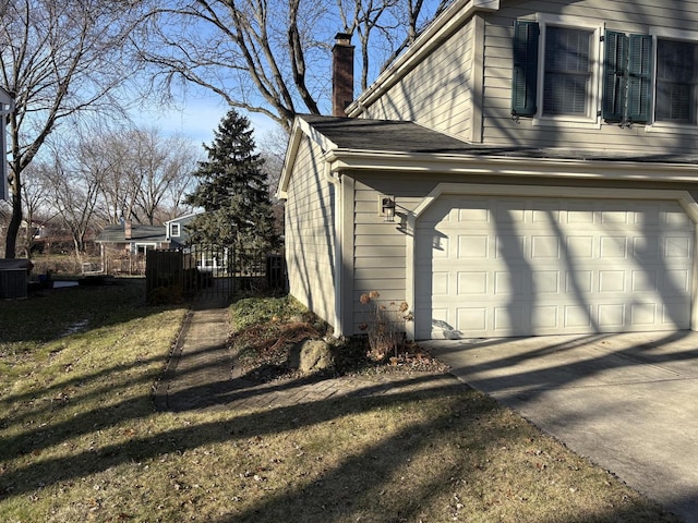 view of side of property featuring a yard and central air condition unit