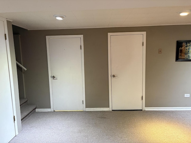 unfurnished bedroom featuring light carpet