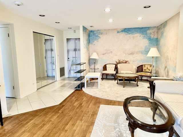 living area with light hardwood / wood-style flooring