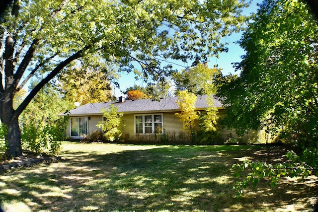 view of front of home with a front yard