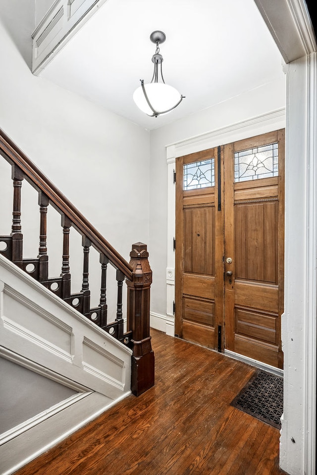 foyer entrance featuring dark hardwood / wood-style flooring