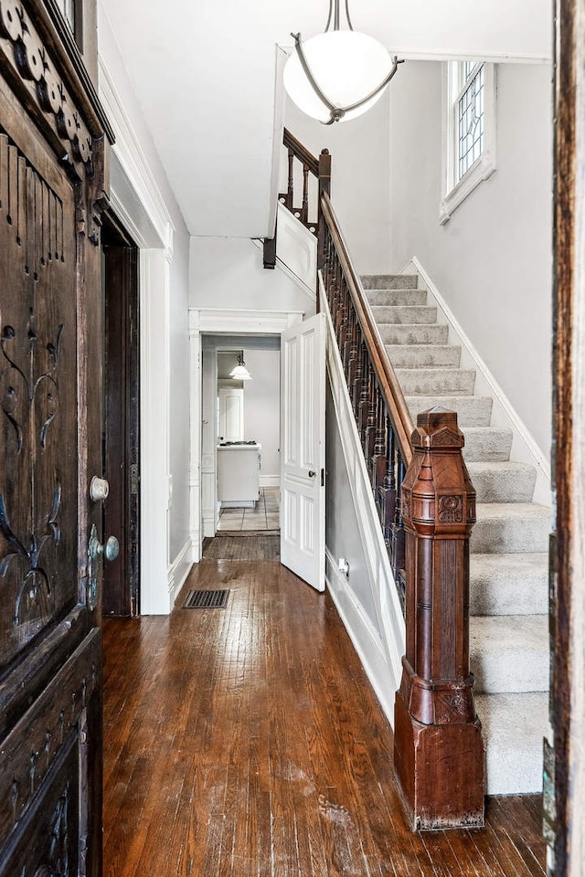 entrance foyer featuring dark hardwood / wood-style flooring